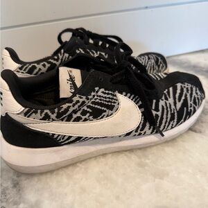 Animal print striped black and white Nike sneakers gym shoes swift
